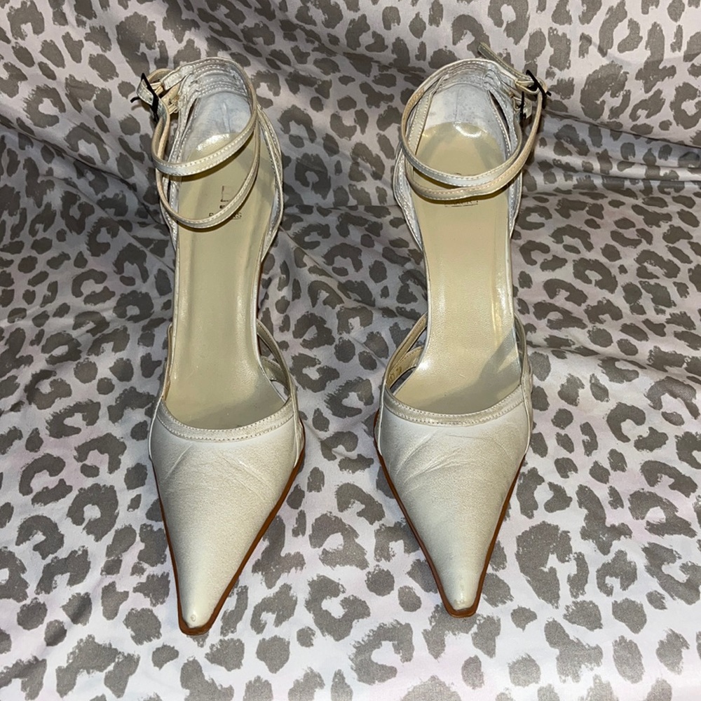 Bakers Bone colored pointed toe double ankle strap high heel shoes